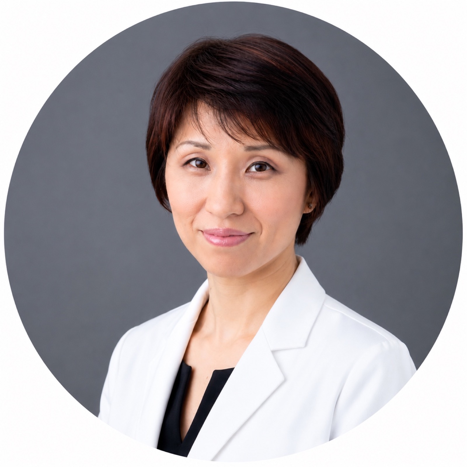 Shizue Hayashi Ito, L.Ac., wearing a white clinical coat