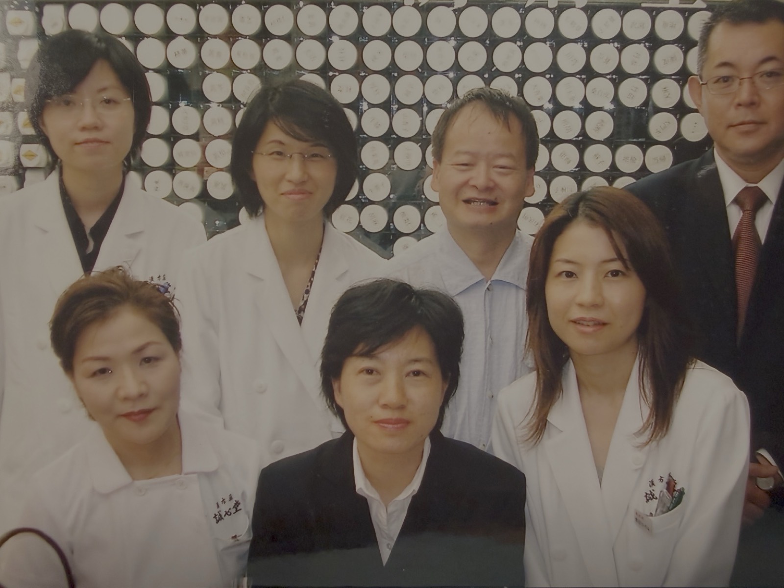 Shizue with the president, managers, and practitioners at Seishindo Kampo Pharmacy
